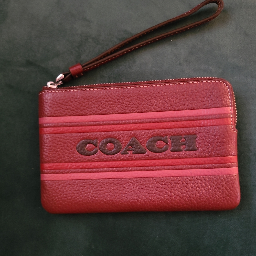 Coach wristlet. Color-Wine. New with tags.